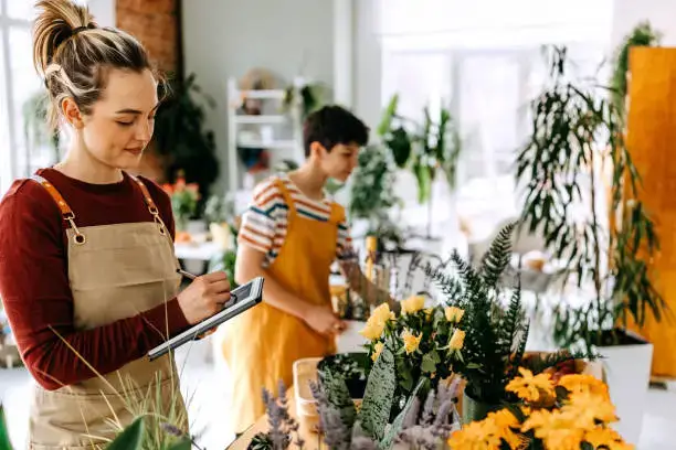 girl florist working in flower shop ajman