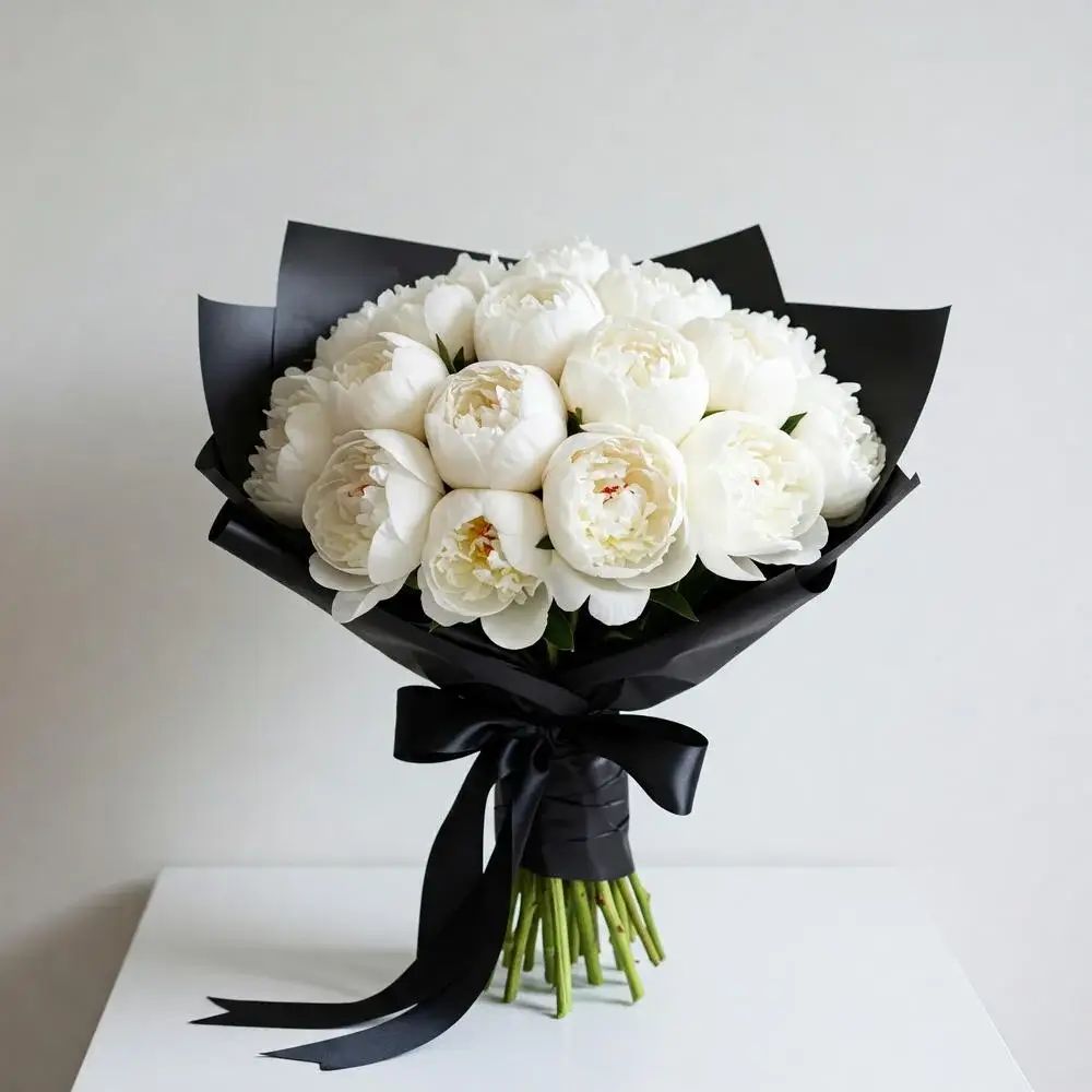 Elegant bouquet of white peonies with lush green foliage