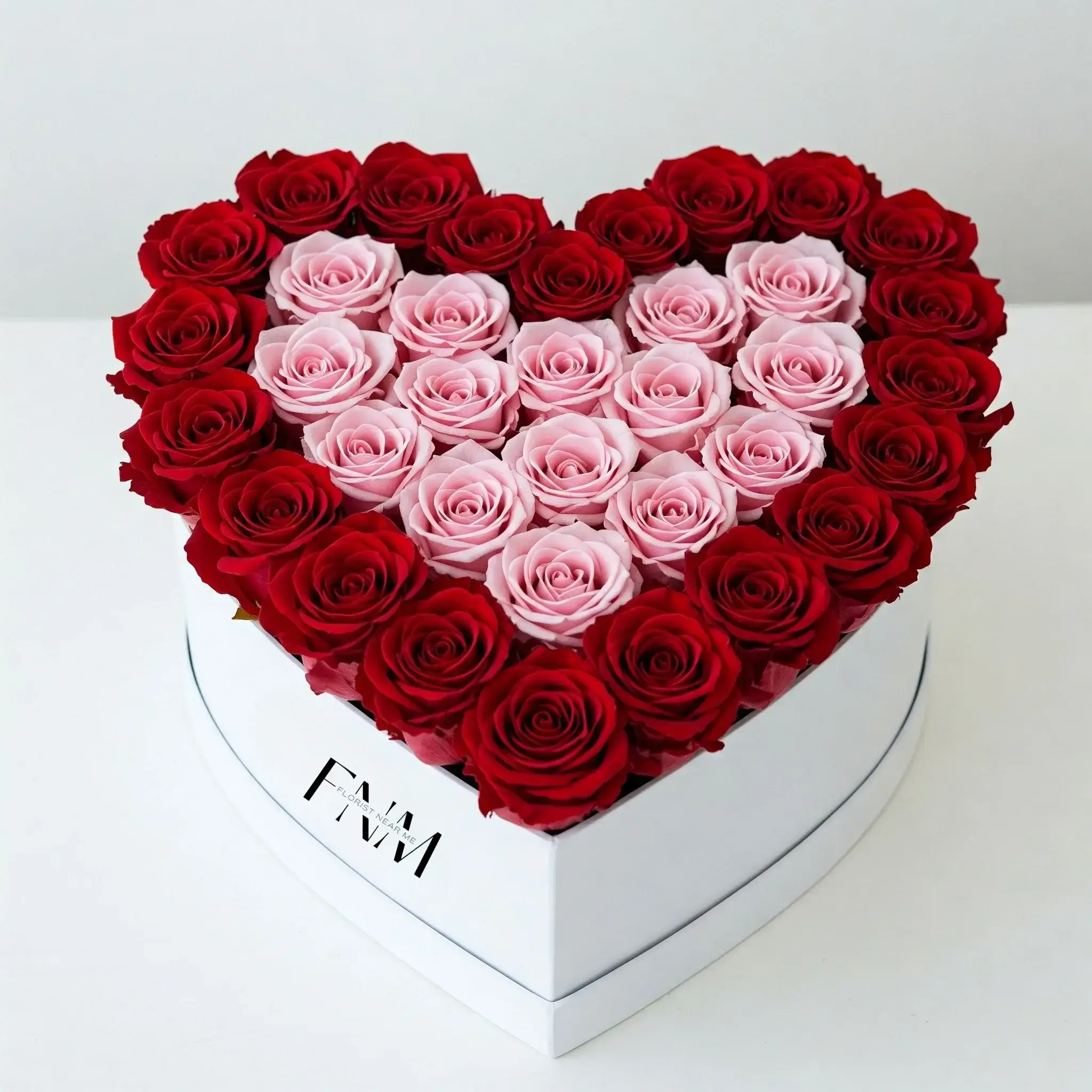 Fresh pink and red roses in white box – flower delivery UAE